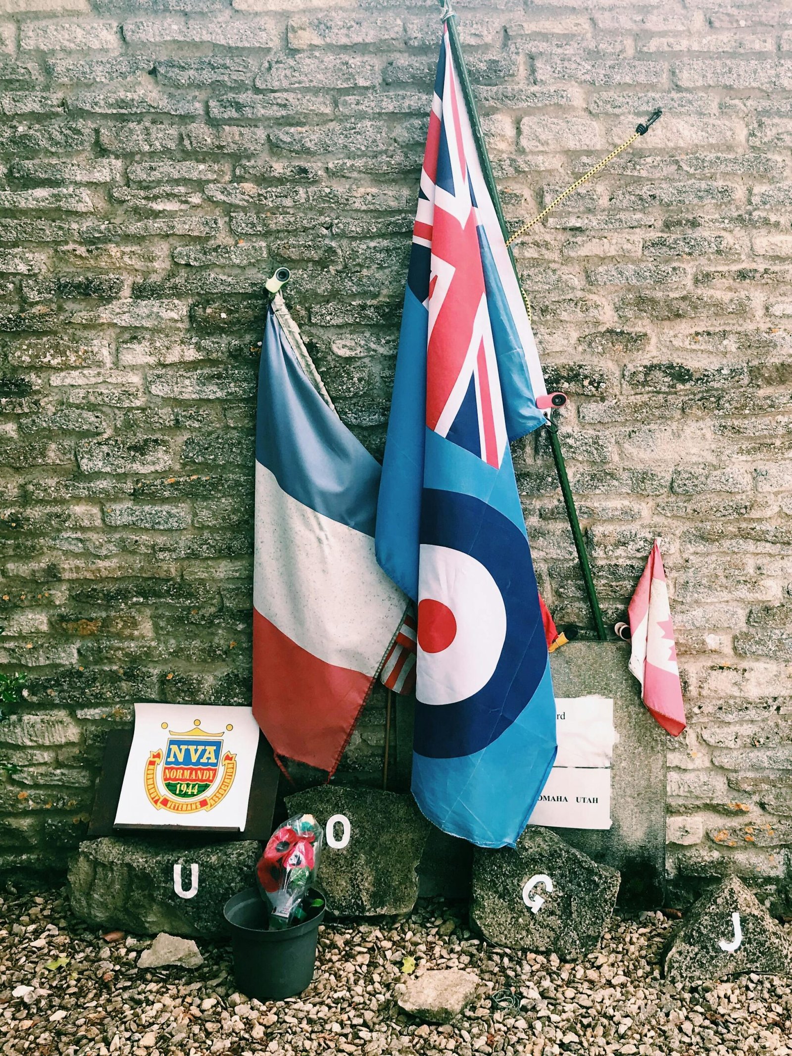 Flags and memorial stones honoring the Royal Air Force in Kemble, England.